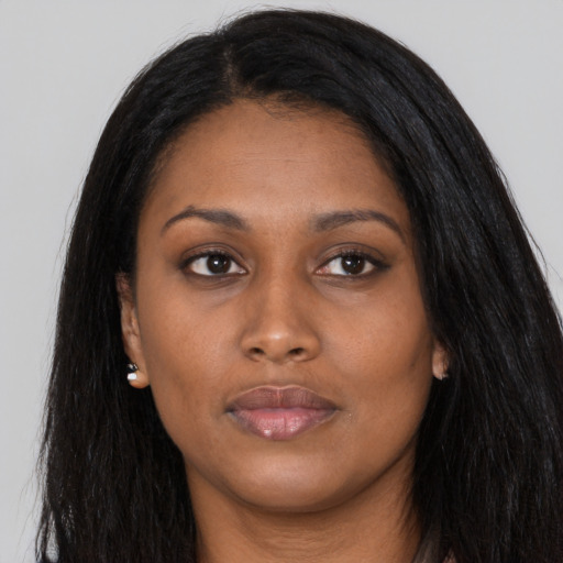 Joyful asian young-adult female with long  black hair and brown eyes