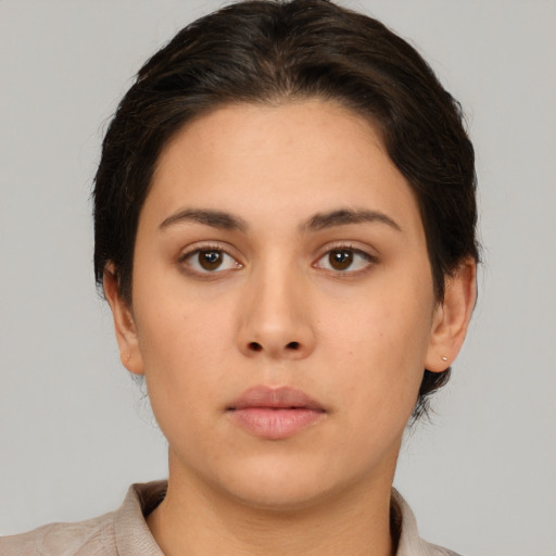 Neutral white young-adult female with short  brown hair and brown eyes