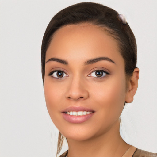 Joyful white young-adult female with long  black hair and brown eyes