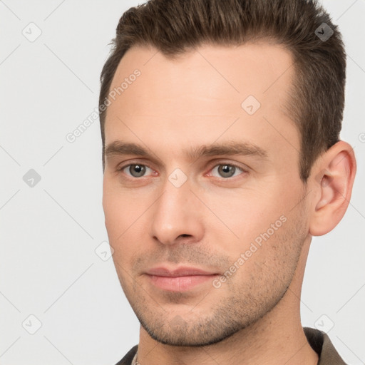 Joyful white young-adult male with short  brown hair and brown eyes