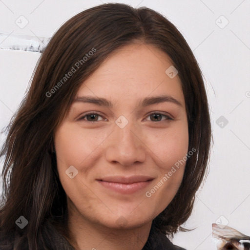 Joyful white young-adult female with long  brown hair and brown eyes