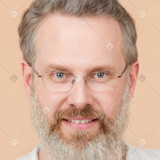 Joyful white adult male with short  brown hair and grey eyes