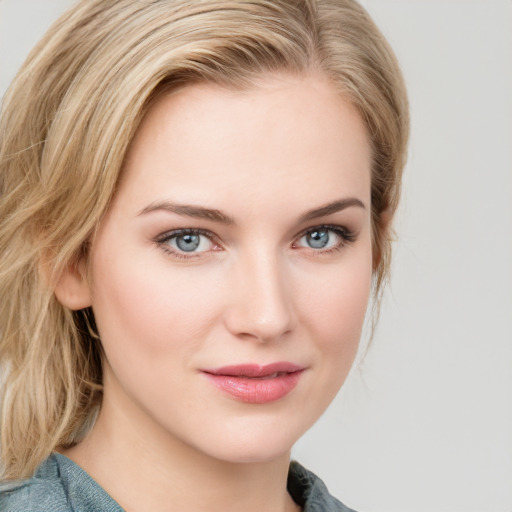 Joyful white young-adult female with medium  brown hair and blue eyes