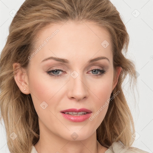 Joyful white young-adult female with long  brown hair and blue eyes