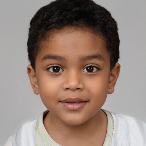 Joyful latino child male with short  brown hair and brown eyes