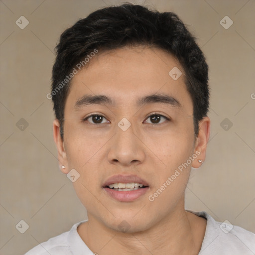 Joyful white young-adult male with short  black hair and brown eyes
