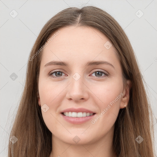 Joyful white young-adult female with long  brown hair and grey eyes