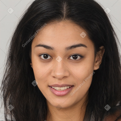 Joyful latino young-adult female with long  brown hair and brown eyes