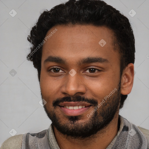 Joyful black young-adult male with short  black hair and brown eyes