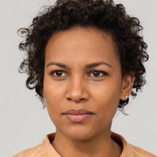 Neutral white young-adult female with short  brown hair and brown eyes