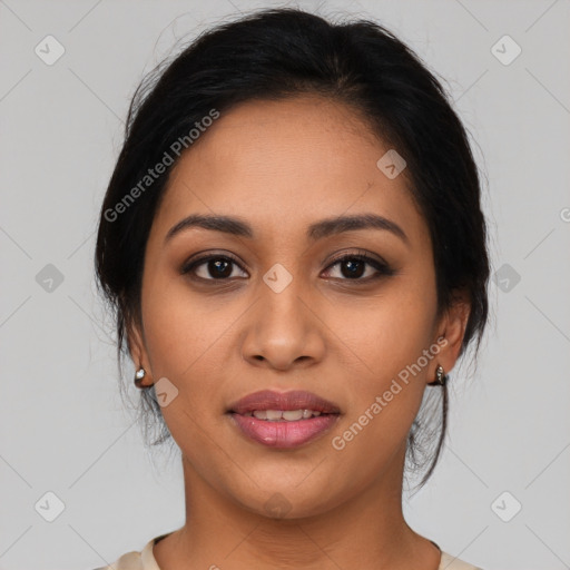 Joyful latino young-adult female with medium  brown hair and brown eyes