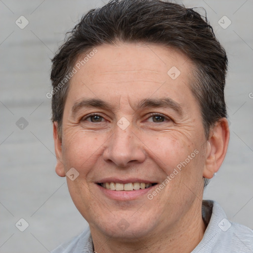 Joyful white adult male with short  brown hair and brown eyes