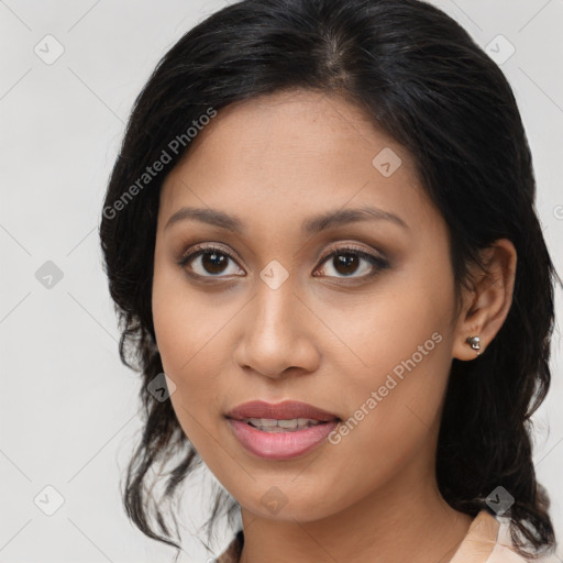 Joyful latino young-adult female with medium  brown hair and brown eyes