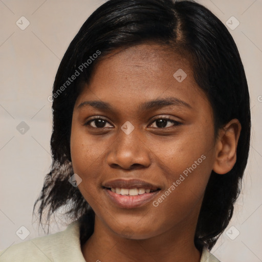 Joyful black young-adult female with medium  black hair and brown eyes