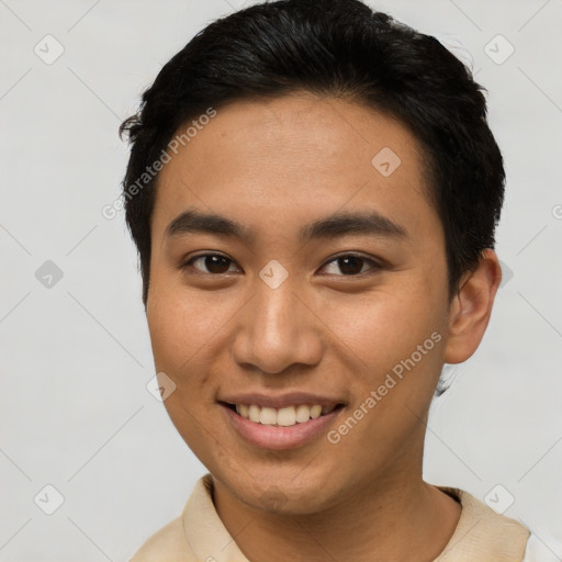 Joyful asian young-adult male with short  brown hair and brown eyes