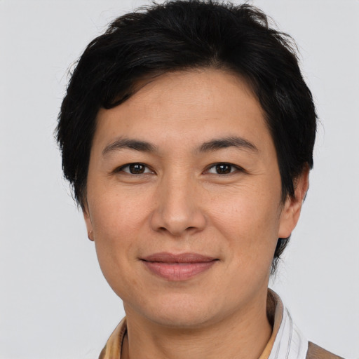 Joyful latino young-adult male with short  brown hair and brown eyes