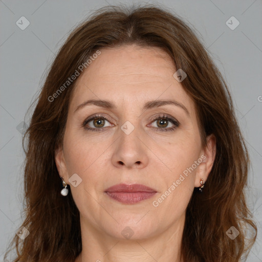 Joyful white adult female with medium  brown hair and brown eyes