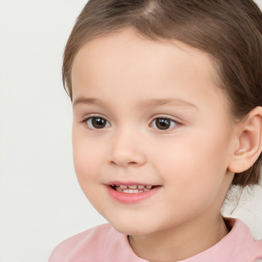 Joyful white child female with short  brown hair and brown eyes