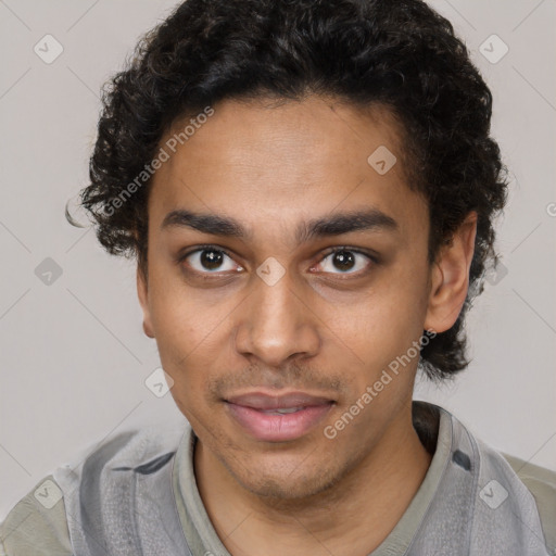 Joyful latino young-adult male with short  brown hair and brown eyes