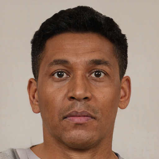 Neutral latino young-adult male with short  brown hair and brown eyes