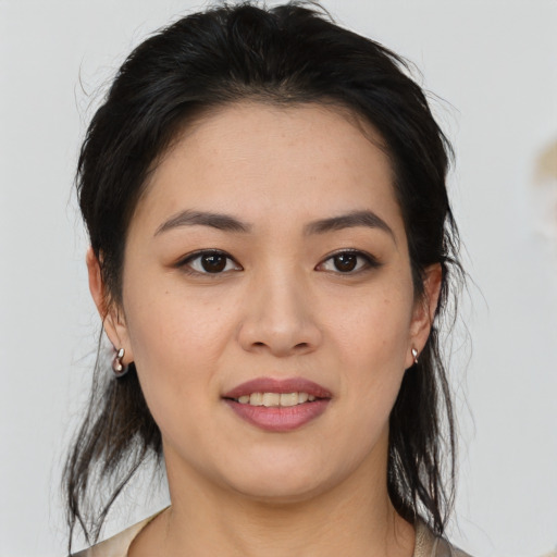 Joyful asian young-adult female with medium  brown hair and brown eyes