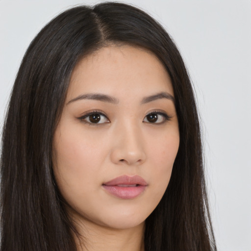 Neutral asian young-adult female with long  brown hair and brown eyes