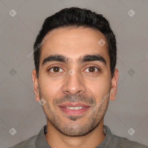 Joyful white young-adult male with short  black hair and brown eyes