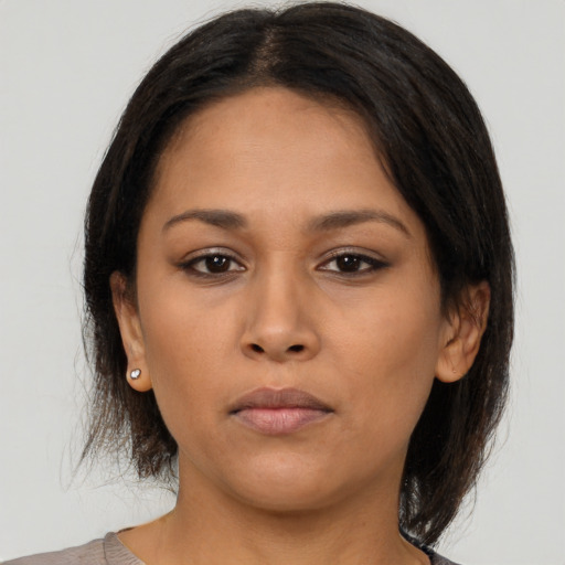 Neutral asian young-adult female with medium  brown hair and brown eyes