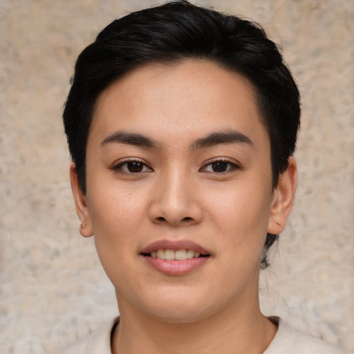 Joyful asian young-adult female with short  black hair and brown eyes