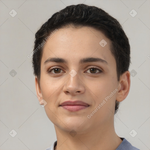 Joyful latino young-adult female with short  black hair and brown eyes