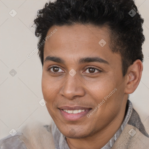 Joyful latino young-adult male with short  brown hair and brown eyes