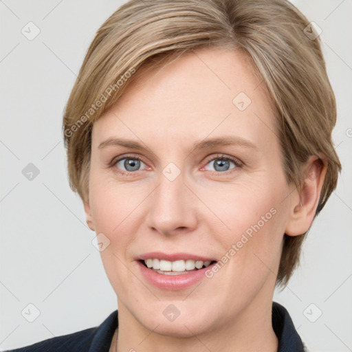 Joyful white adult female with medium  brown hair and blue eyes