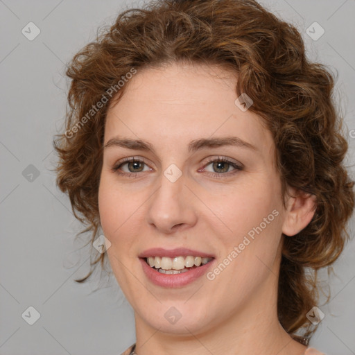 Joyful white young-adult female with medium  brown hair and green eyes