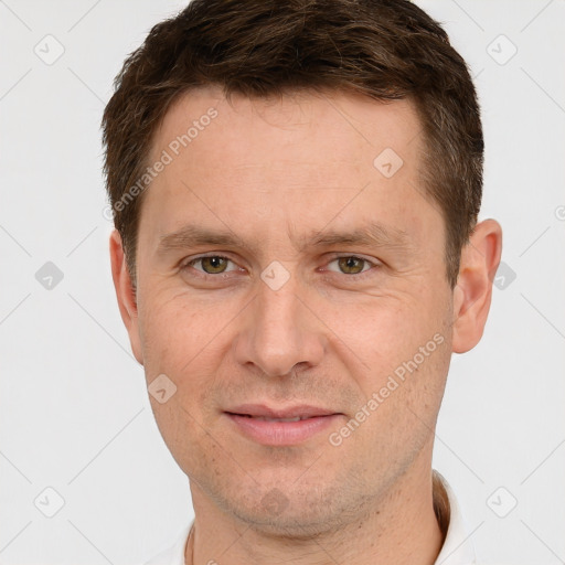 Joyful white adult male with short  brown hair and grey eyes