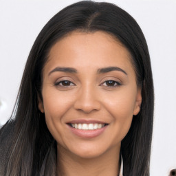 Joyful latino young-adult female with long  brown hair and brown eyes