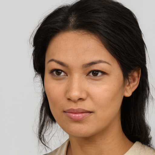 Joyful asian adult female with medium  brown hair and brown eyes