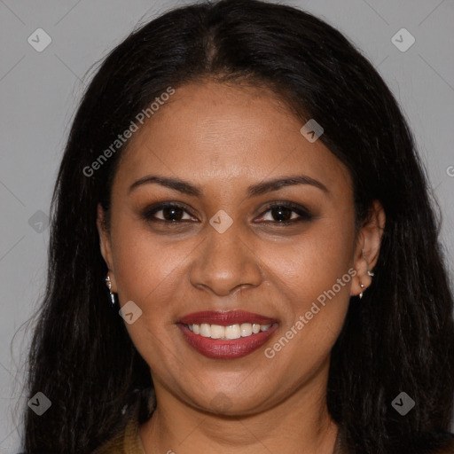 Joyful black young-adult female with long  brown hair and brown eyes