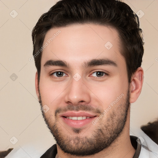 Joyful white young-adult male with short  black hair and brown eyes