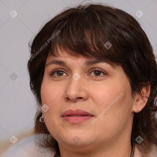 Joyful white adult female with medium  brown hair and brown eyes