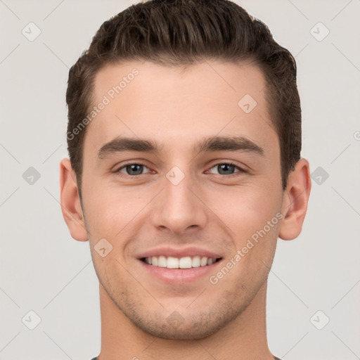 Joyful white young-adult male with short  brown hair and brown eyes