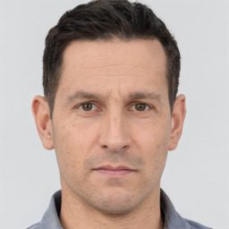 Neutral white adult male with short  brown hair and brown eyes