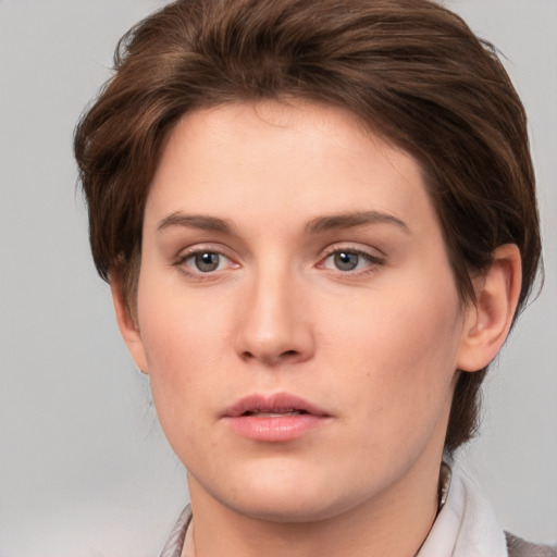 Neutral white young-adult female with medium  brown hair and brown eyes