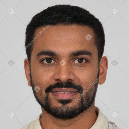 Joyful black young-adult male with short  black hair and brown eyes
