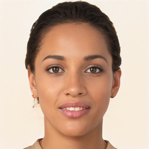 Joyful latino young-adult female with short  brown hair and brown eyes