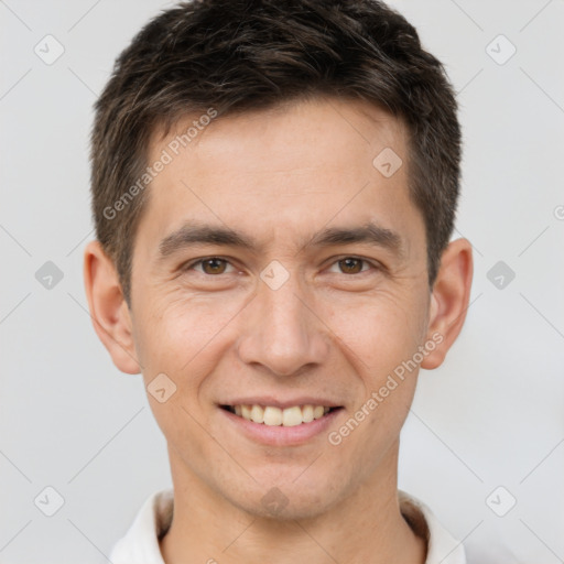 Joyful white young-adult male with short  brown hair and brown eyes