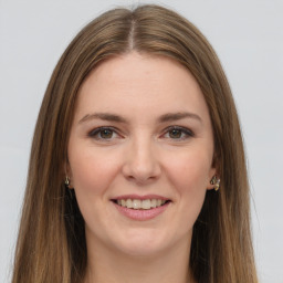 Joyful white young-adult female with long  brown hair and grey eyes