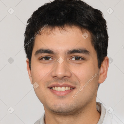 Joyful white young-adult male with short  black hair and brown eyes