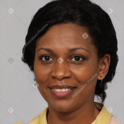 Joyful latino adult female with short  brown hair and brown eyes