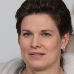 Joyful white adult female with short  brown hair and brown eyes