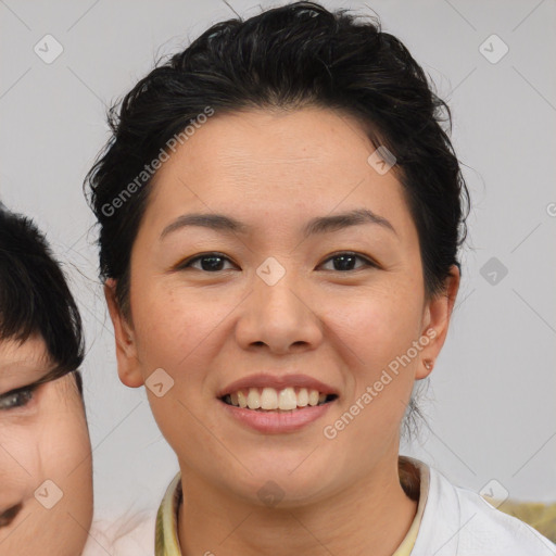 Joyful asian young-adult female with medium  brown hair and brown eyes